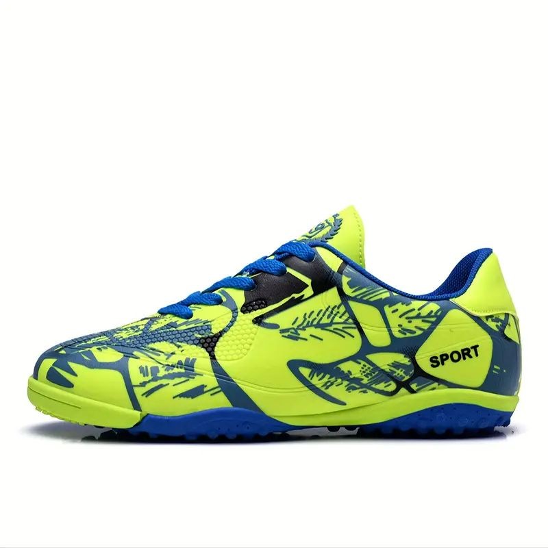 Bright yellow and blue sports shoe with graphic patterns and black accents, designed for indoor athletic activities.