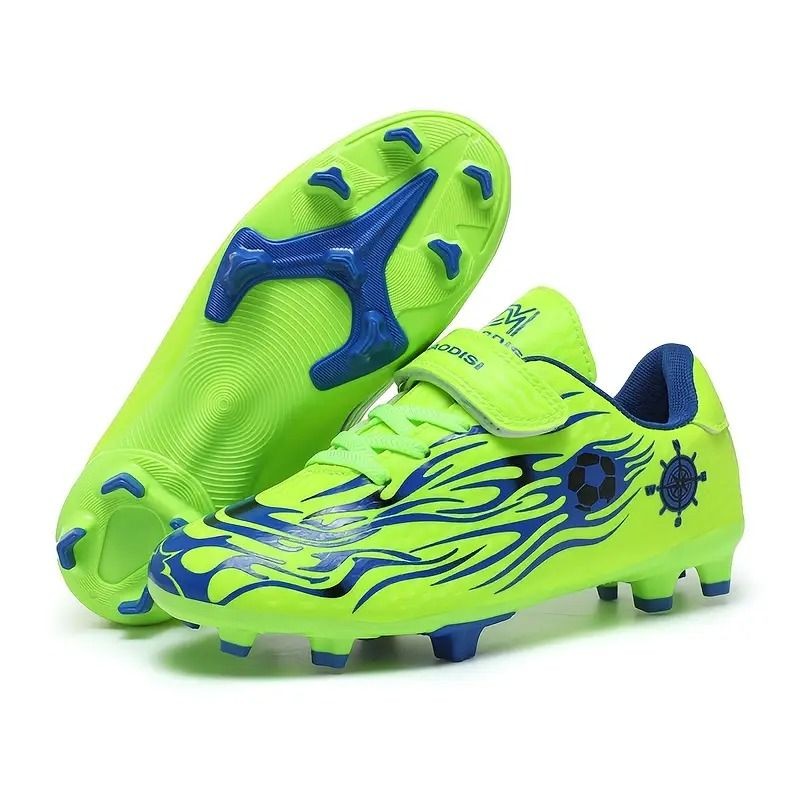 Bright green soccer cleats with blue flame design and blue studs.